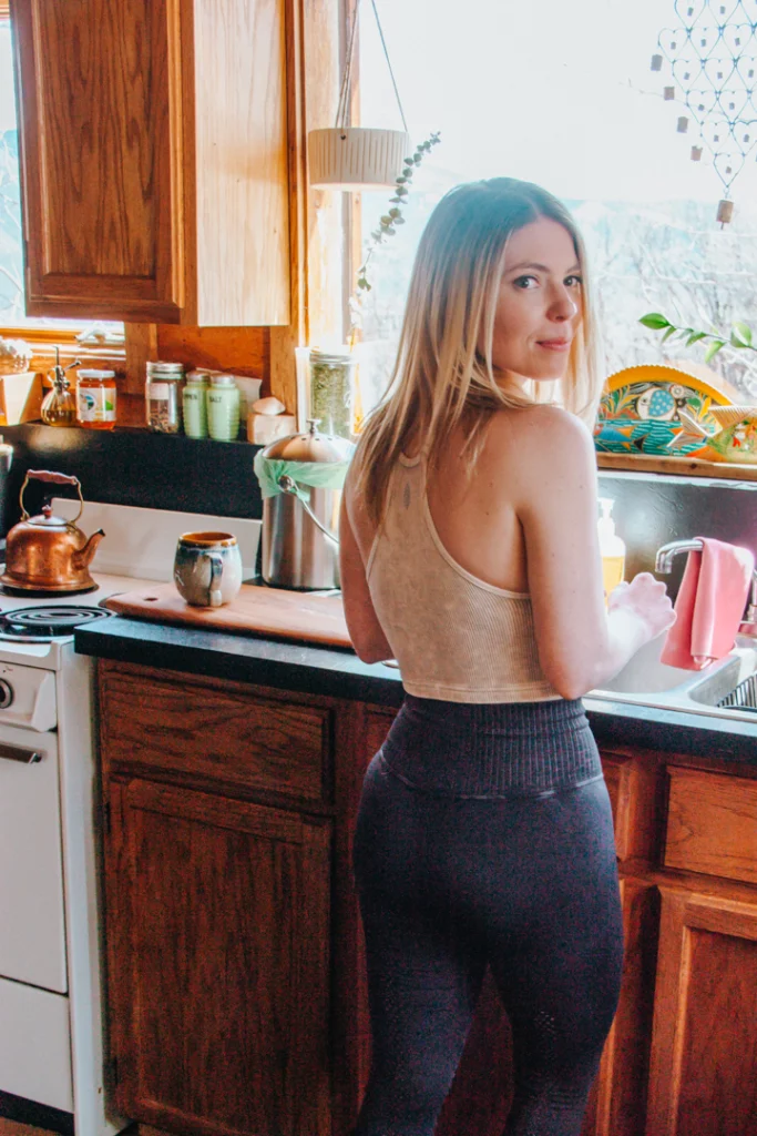 girl at the sink in a kitchen